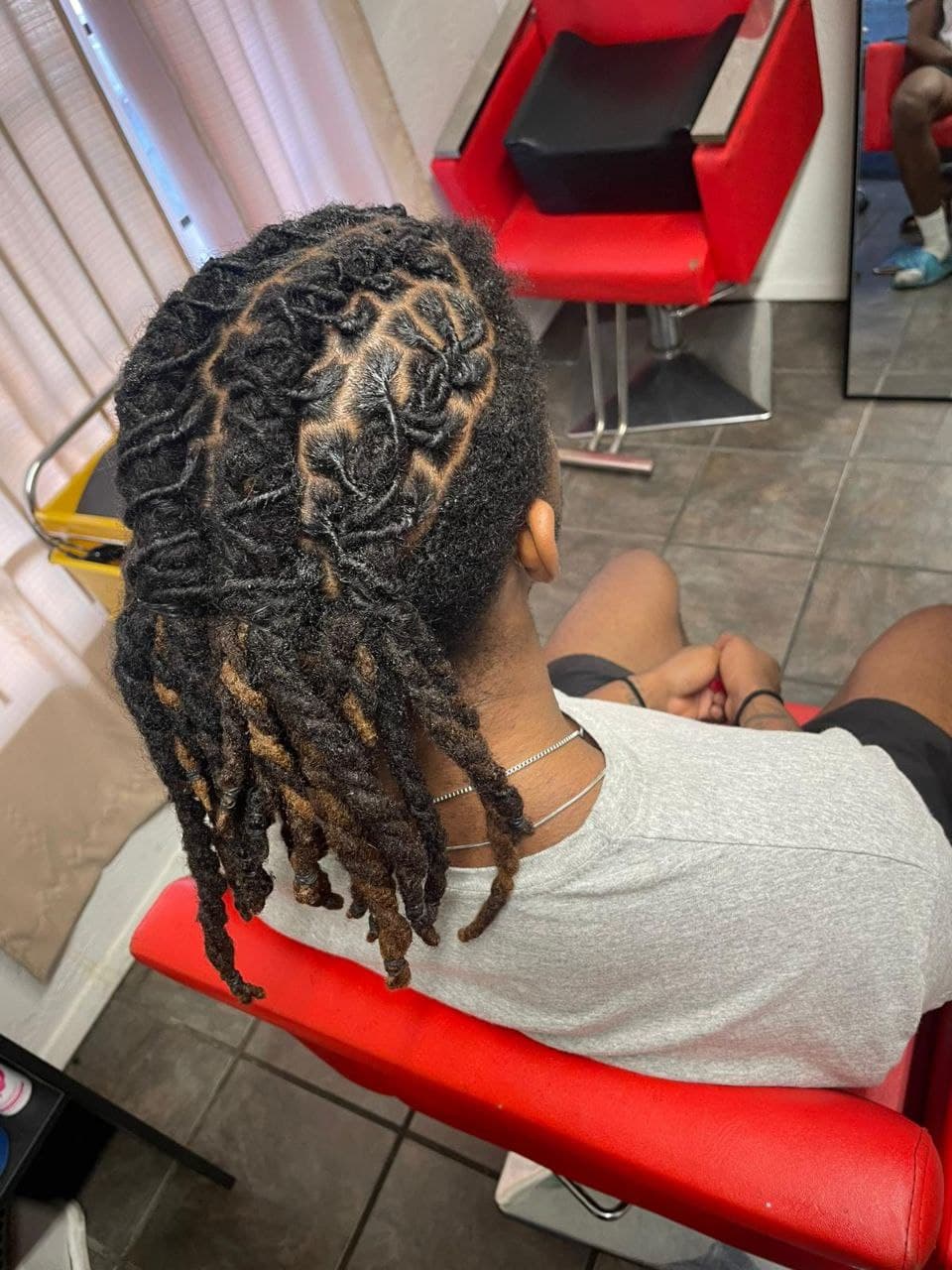 Locs vs Braids: Which Protective Style is Right for You?