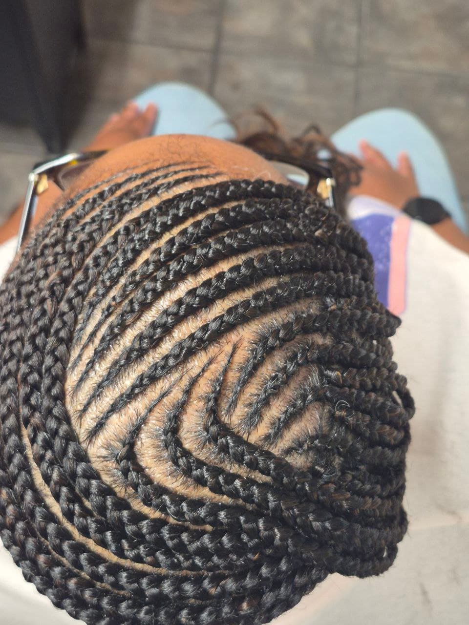 Beautiful female cornrows hairstyle - East Tucson salon